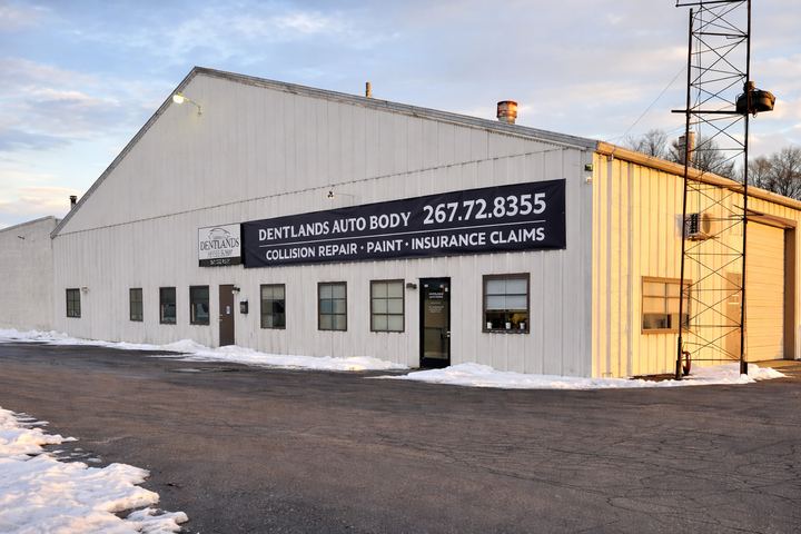 shop exterior with sign and phone (winter)